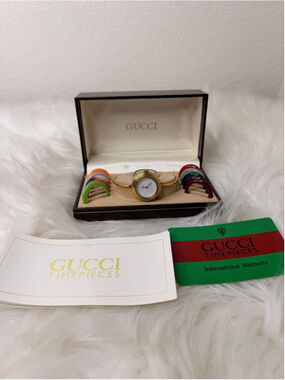 Vintage Gucci Interchangeable Bezel Bangle Watch, w/ 12 bezels, box & paperwork